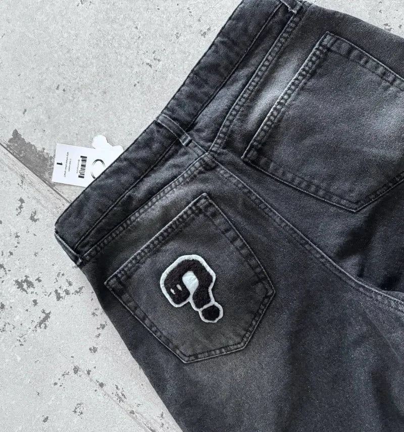 Loose jeans with a retro gothic pattern